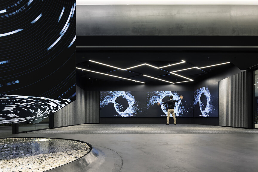 A man walking in a large room.